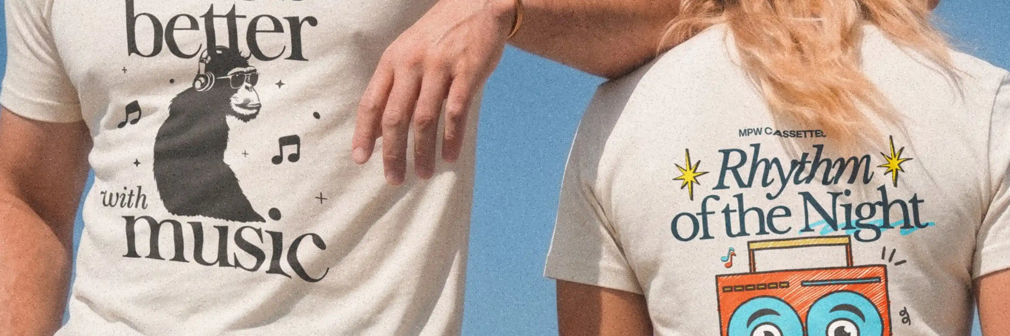 Man in white graphic tee reading ‘Life's better with music’ and women wearing white graphic tee reading 'Rhythm of the Night' 