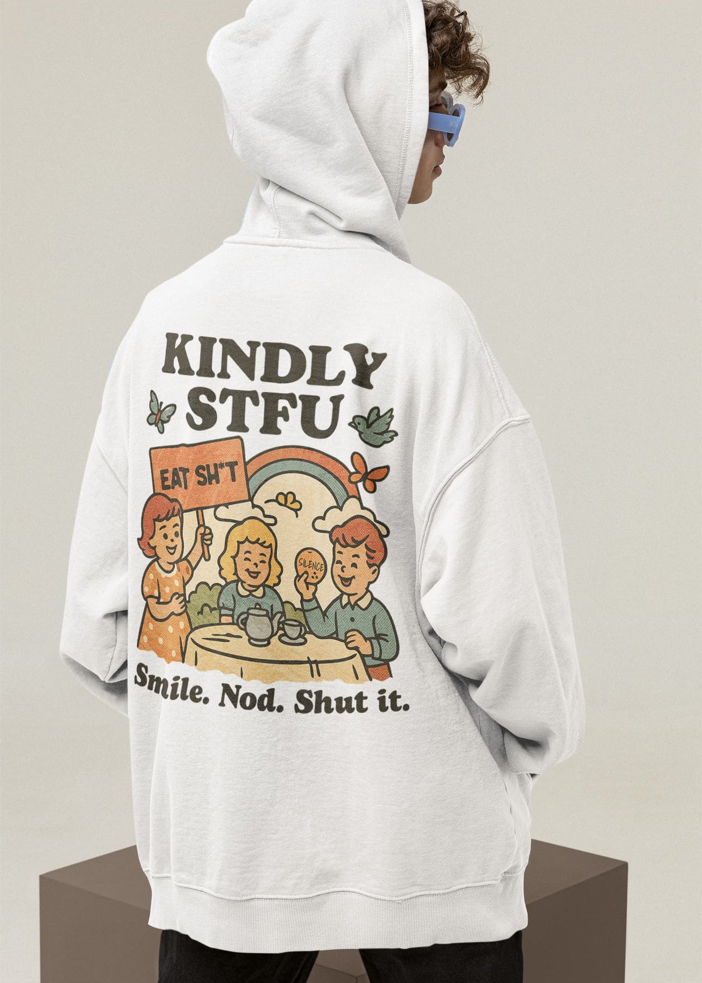 Person wearing a white hoodie with a graphic design on the back against a plain background